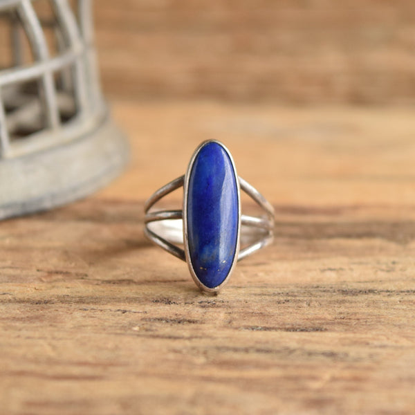 Long Blue Lapis Sterling Silver Ring Size 9 on wood backdrop